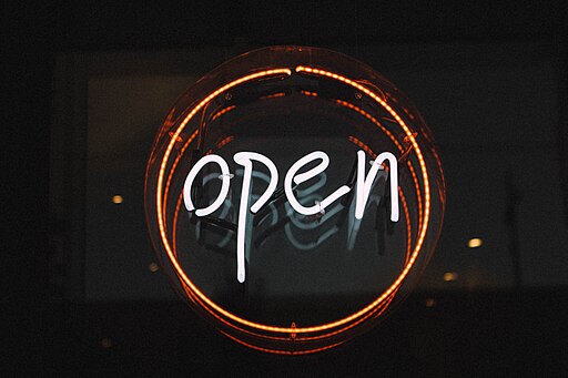 A round “open” neon in white and red